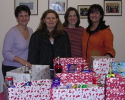 Members of St Paul's, Lisburn, MU, with their party boxes for families.